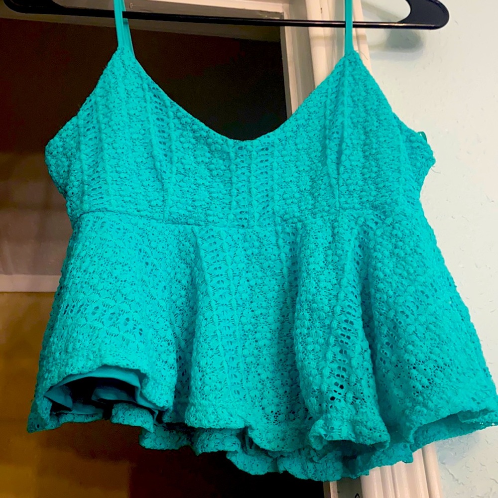 A cropped Turquoise Cute shirt